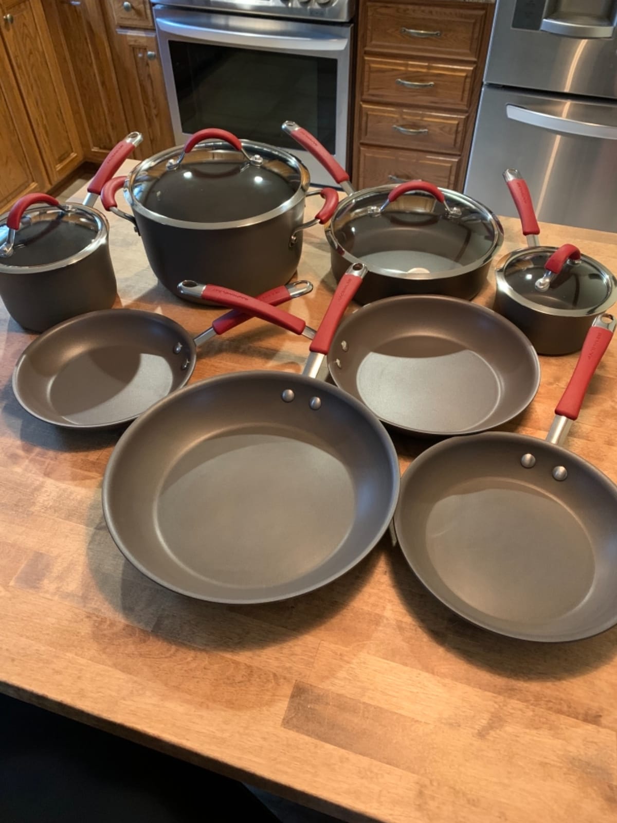Rachael Ray Cucina Dishwasher-Safe Hard-Anodized Pots and Pans Set Non Stick Cookware, 12-Piece, Gray with Red Handles customer photo 2